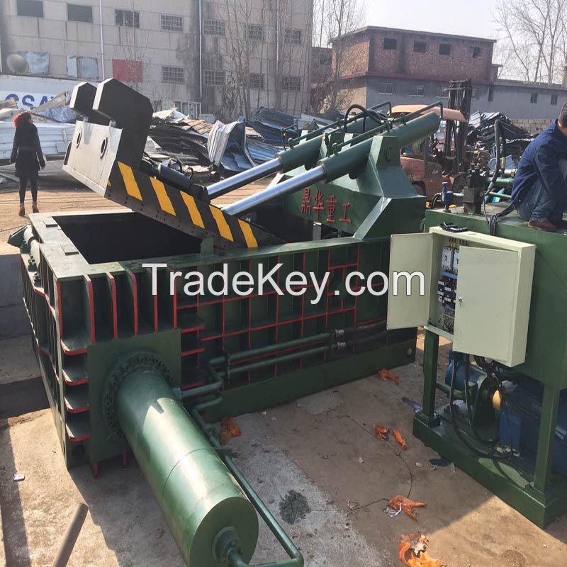 Scrap metal baler machine