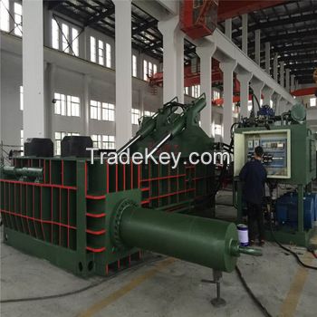 Scrap metal baler machine