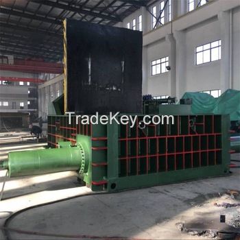 Scrap metal baler machine