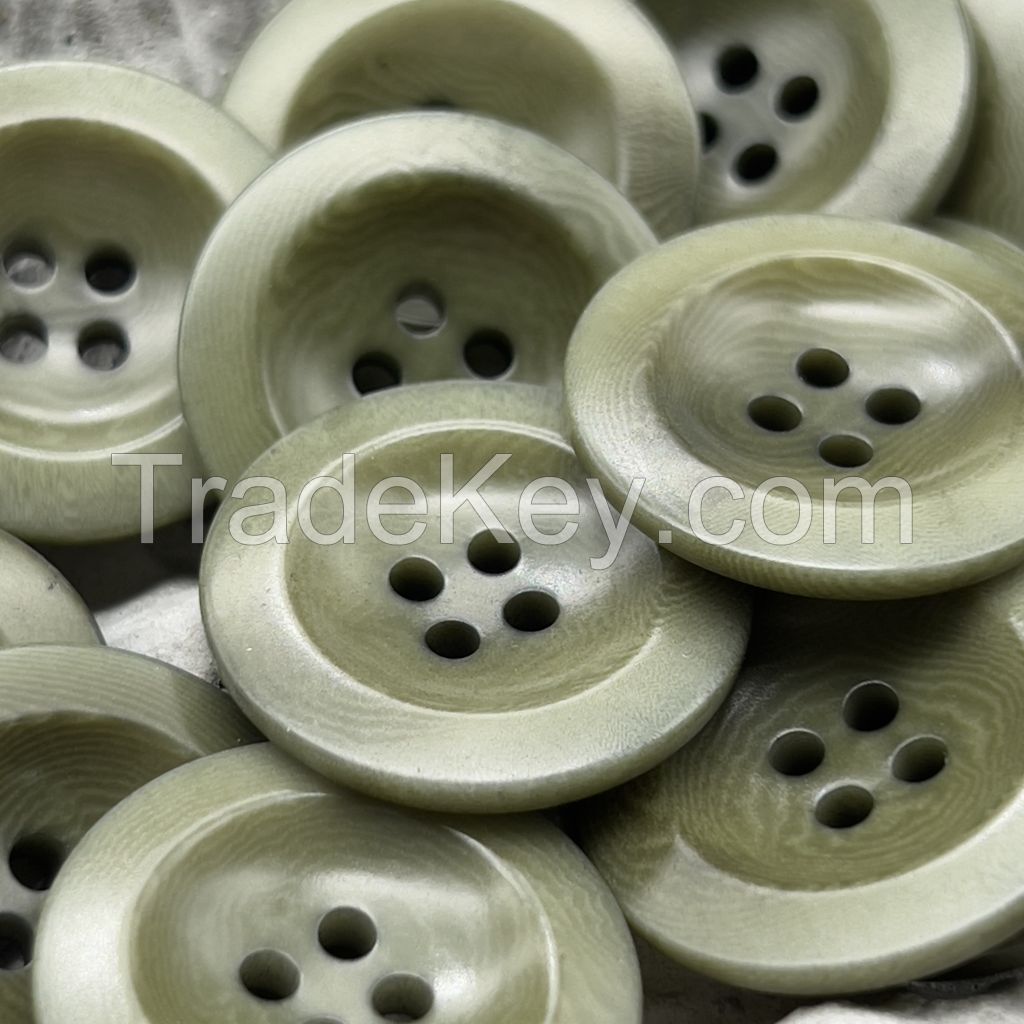 In stock bowl shape corozo buttons in in dark brown, green, white, black and ginger color