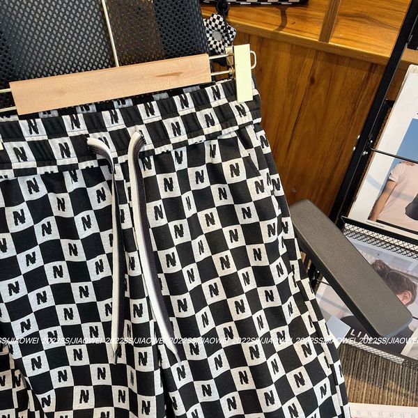 Black and white plaid slacks women's 2022 new European hot high-waiste