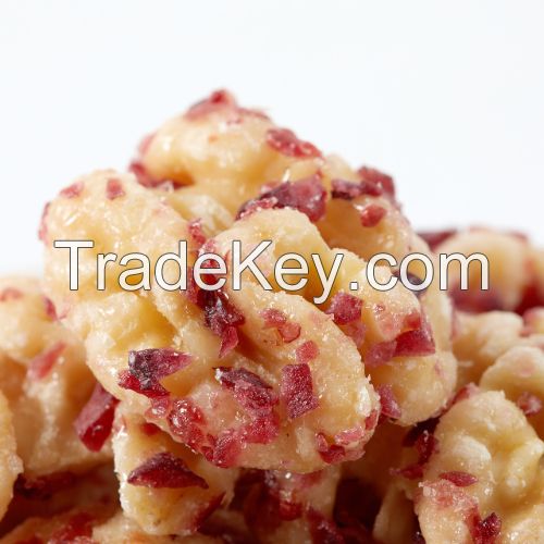 Cranberry flavored peeled walnut kernels for casual snacking