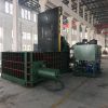 Scrap metal baler machine