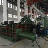 Scrap metal baler machine