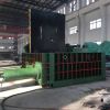 Scrap metal baler machine