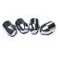 Wedged tungsten carbide buttons for oil drilling tools