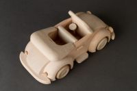Children's wooden toy car in retro style for play and creativity.